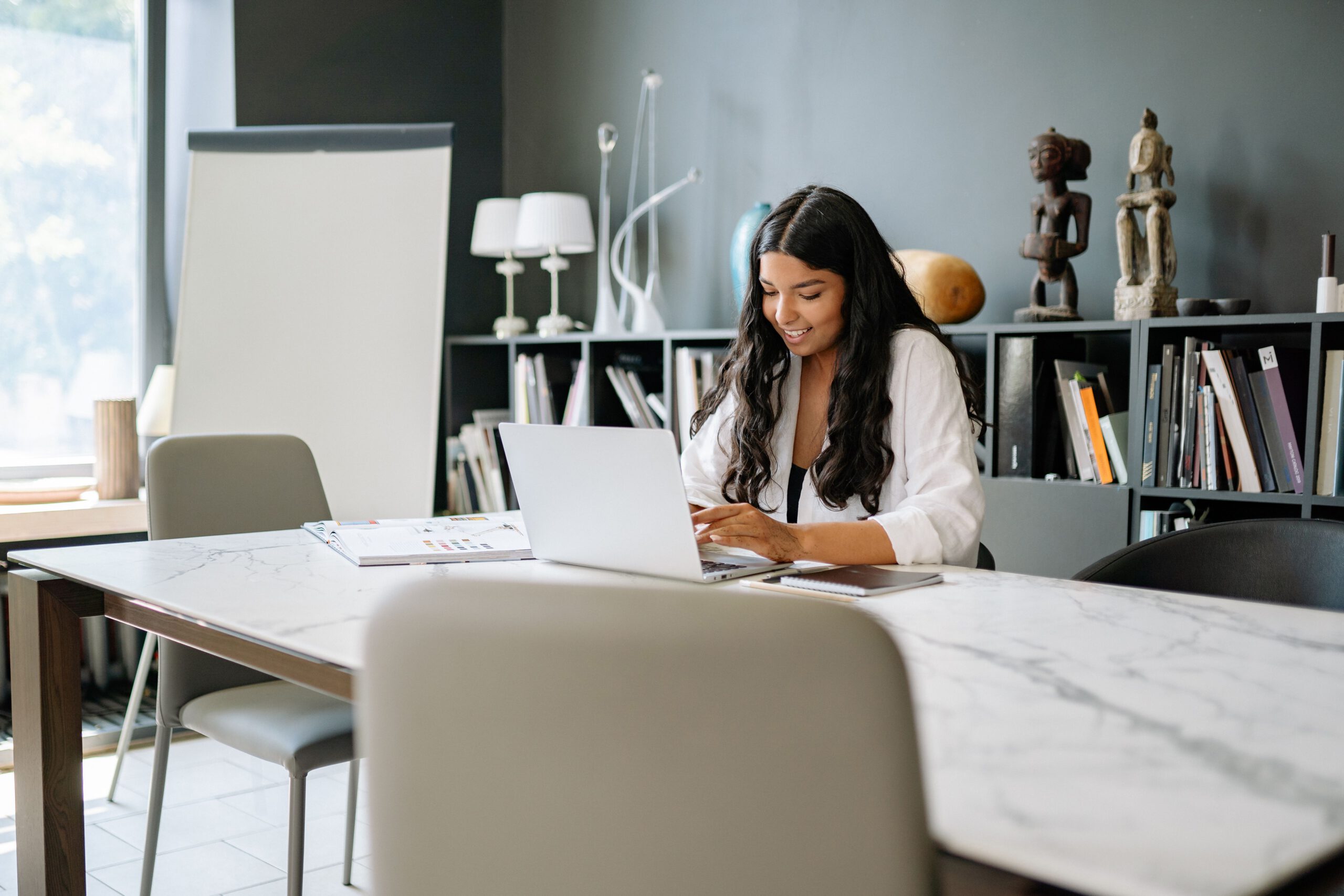 Woman prepares her desk to help clients with payroll